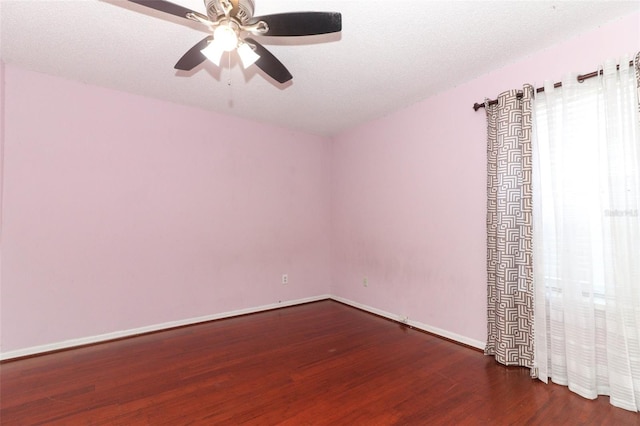 empty room featuring ceiling fan, a textured ceiling, and hardwood / wood-style floors