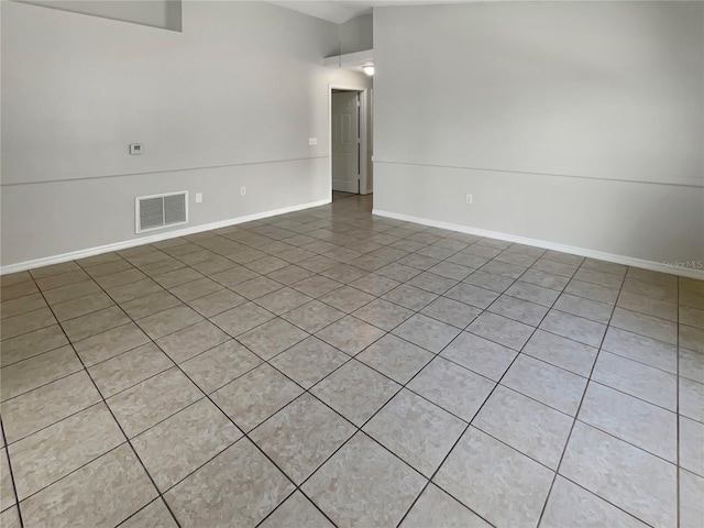 empty room featuring vaulted ceiling