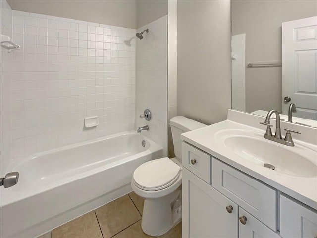 full bathroom with tile patterned floors, toilet, vanity, and tiled shower / bath