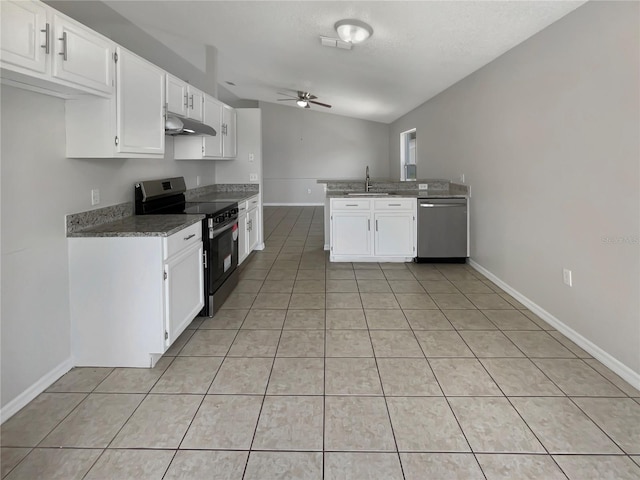 kitchen with white cabinetry, stainless steel appliances, and light tile patterned floors