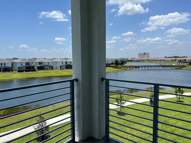 balcony featuring a water view