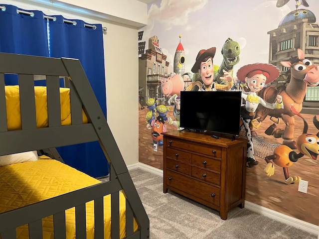 bedroom featuring carpet flooring and baseboards