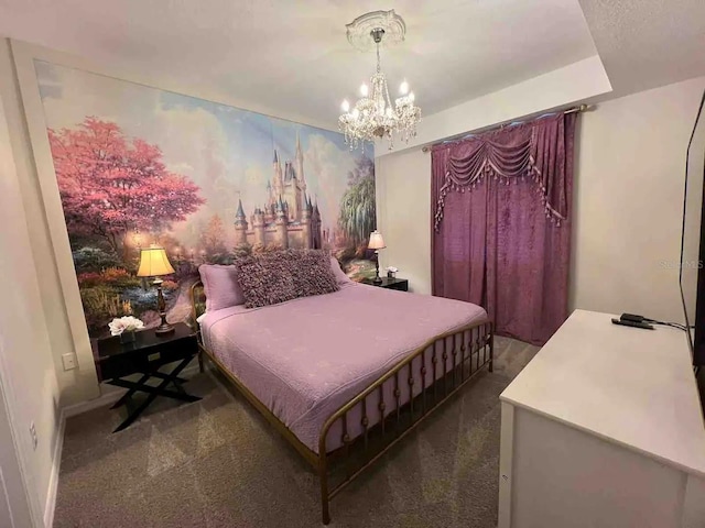 bedroom featuring dark carpet and a notable chandelier