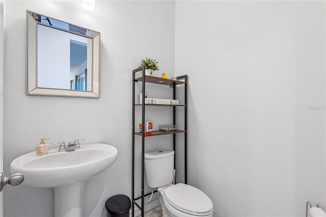 bathroom with a sink and toilet