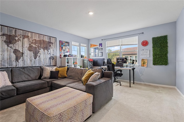 living room featuring baseboards and light colored carpet