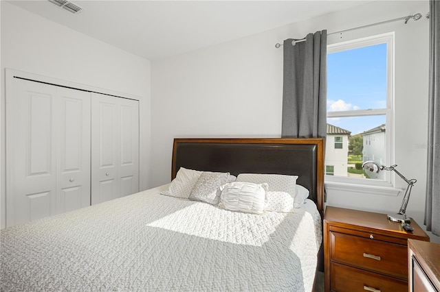 bedroom featuring a closet and visible vents