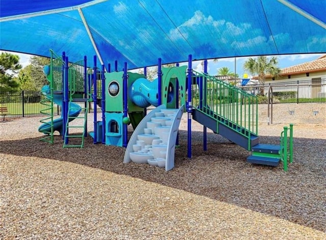 communal playground featuring fence