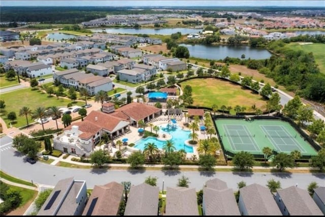 birds eye view of property with a residential view and a water view