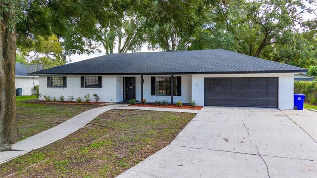 ranch-style house featuring a garage