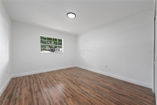 empty room featuring dark wood-type flooring