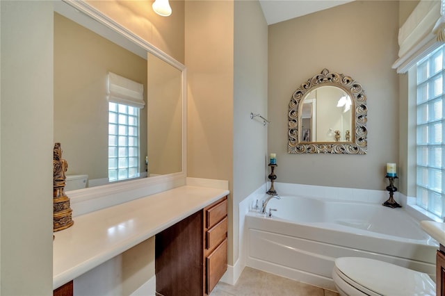 bathroom with plenty of natural light, toilet, and vanity