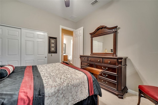 carpeted bedroom with ceiling fan and a closet