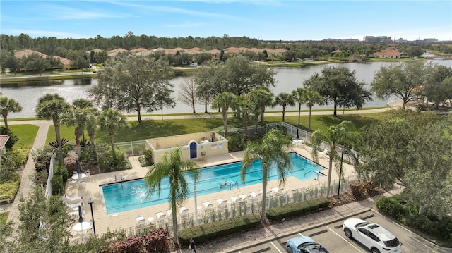 view of pool featuring a water view