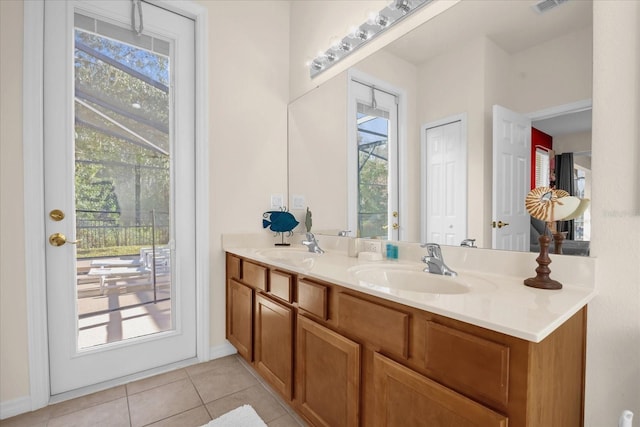 bathroom with tile patterned flooring and vanity