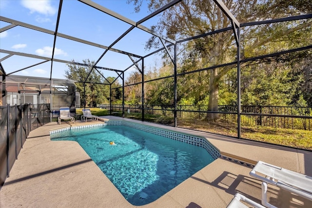 view of pool featuring a patio area and a lanai