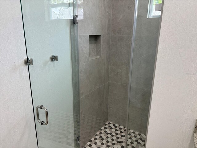 full bathroom featuring a shower stall