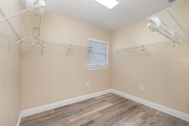 walk in closet featuring hardwood / wood-style floors