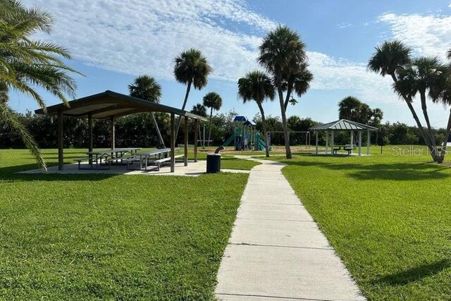 view of property's community featuring a playground, a yard, and a gazebo