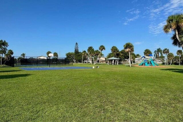 view of community with a gazebo, a yard, and basketball court