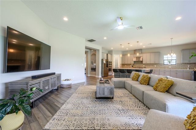 291 Mossy River Ct, Brandon, FL 33511 - living area with a ceiling fan, visible vents, baseboards, and wood finished floors