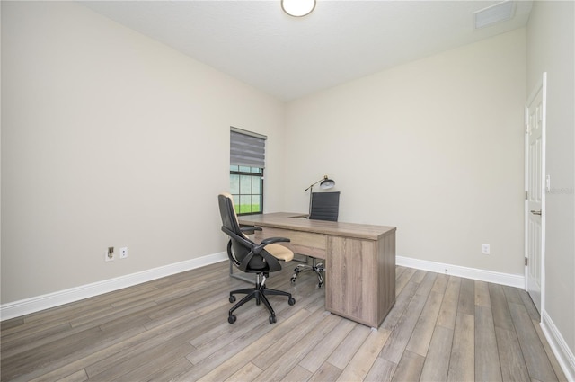 office space featuring light hardwood / wood-style floors