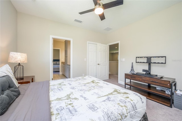 291 Mossy River Ct, Brandon, FL 33511 - bedroom with ensuite bathroom, visible vents, baseboards, ceiling fan, and light colored carpet