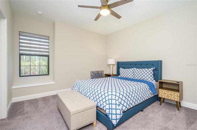 bedroom featuring ceiling fan and carpet