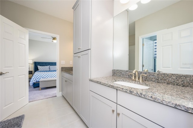 bathroom featuring ceiling fan, tile patterned flooring, and vanity