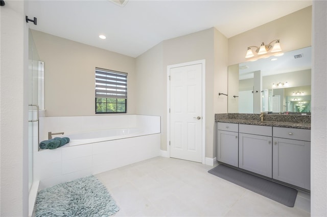 291 Mossy River Ct, Brandon, FL 33511 - bathroom featuring visible vents, vanity, a stall shower, a garden tub, and tile patterned flooring