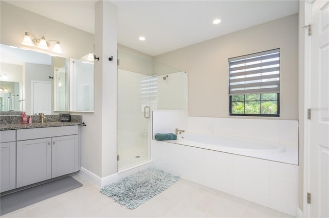 291 Mossy River Ct, Brandon, FL 33511 - bathroom featuring a shower stall, recessed lighting, vanity, a garden tub, and tile patterned flooring