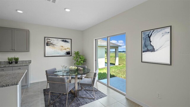 dining area featuring recessed lighting, light tile patterned flooring, and baseboards