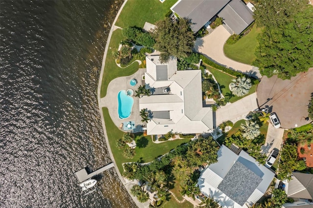 birds eye view of property with a water view