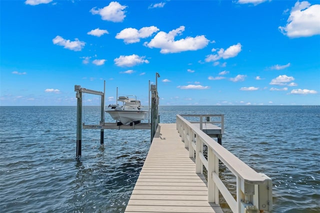 dock area featuring a water view and boat lift