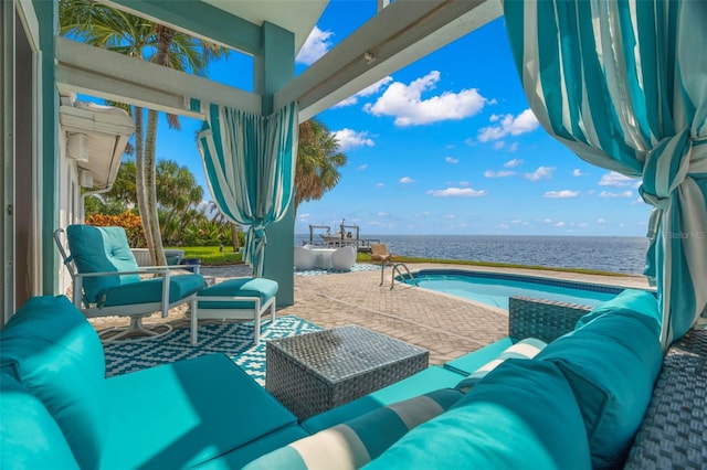 view of patio with a water view and an outdoor hangout area