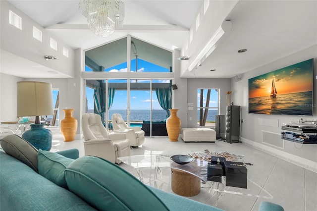 living area with baseboards, high vaulted ceiling, light tile patterned flooring, and an inviting chandelier