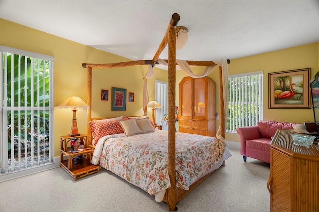 bedroom featuring access to outside and speckled floor