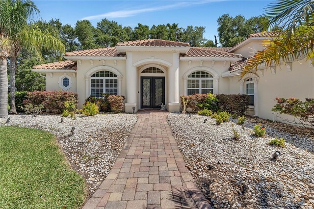 mediterranean / spanish home with french doors