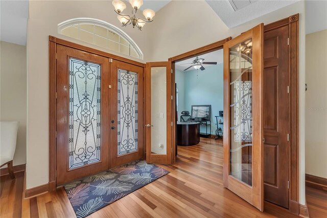 entrance foyer with french doors and wood-type flooring