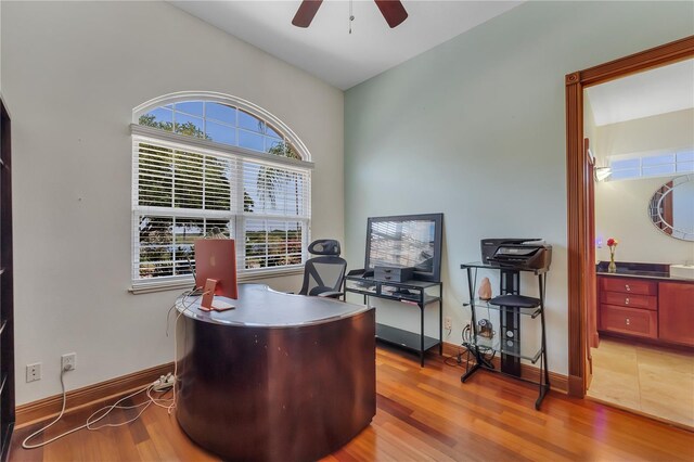 office area with ceiling fan, light hardwood / wood-style floors, and lofted ceiling