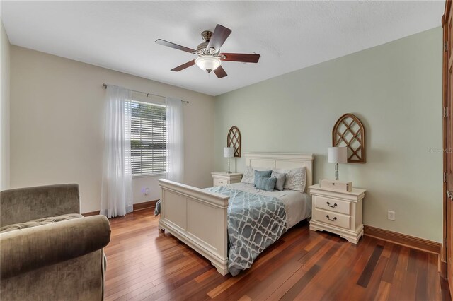 bedroom with ceiling fan and wood-type flooring