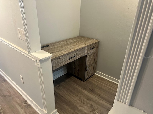 room details with baseboards and wood finished floors