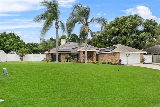 ranch-style house with a front yard and a garage