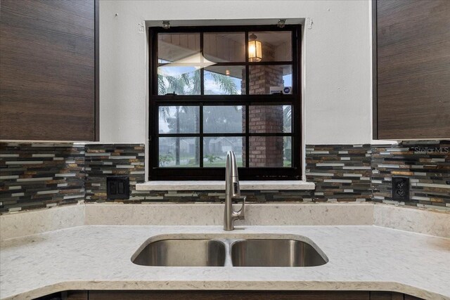 kitchen with sink and tasteful backsplash