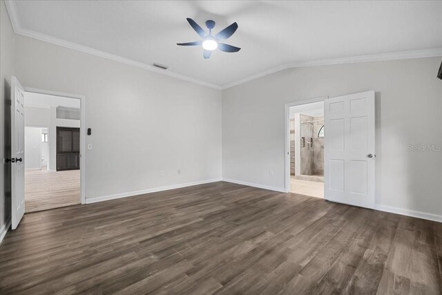 unfurnished bedroom featuring crown molding, lofted ceiling, hardwood / wood-style floors, and ceiling fan