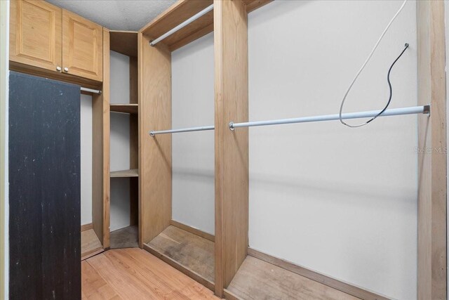 walk in closet featuring light wood-type flooring