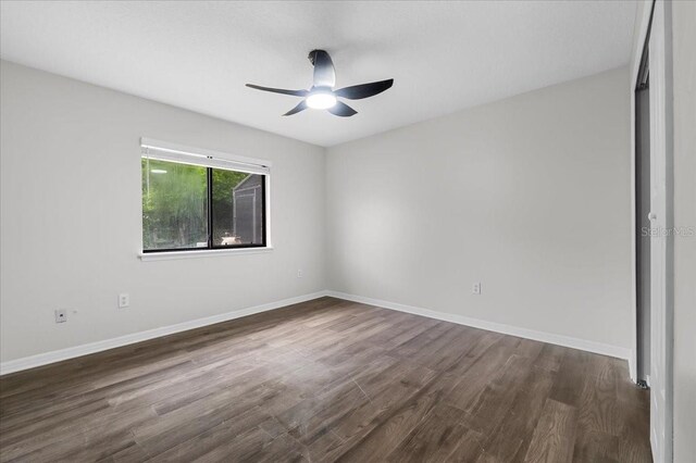 unfurnished room featuring ceiling fan and hardwood / wood-style flooring