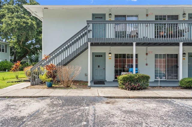 view of front of home with a balcony