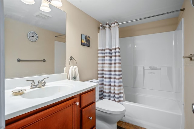 full bathroom with shower / bath combo with shower curtain, vanity, and toilet