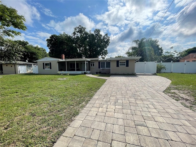 ranch-style home with a front yard