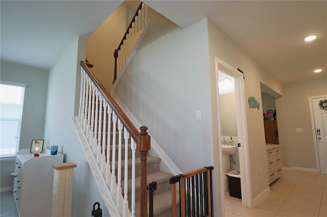 staircase featuring tile patterned flooring, recessed lighting, and baseboards